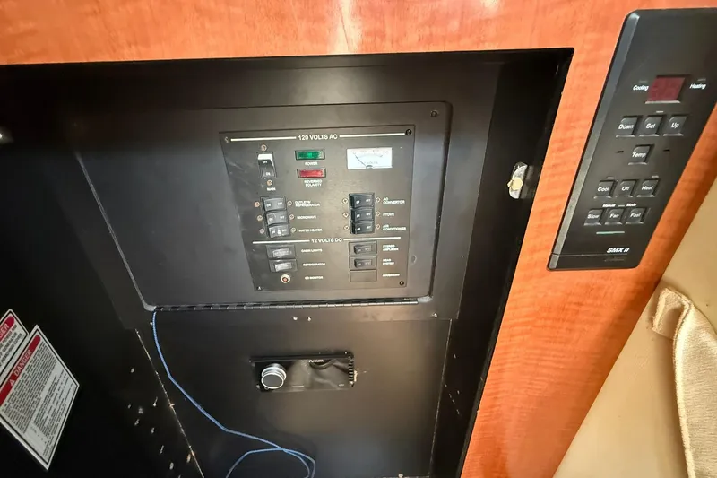 Slide: The Image of Electrical control panel of 2001 Sea Ray 280 Sundancer boat interior. - 18