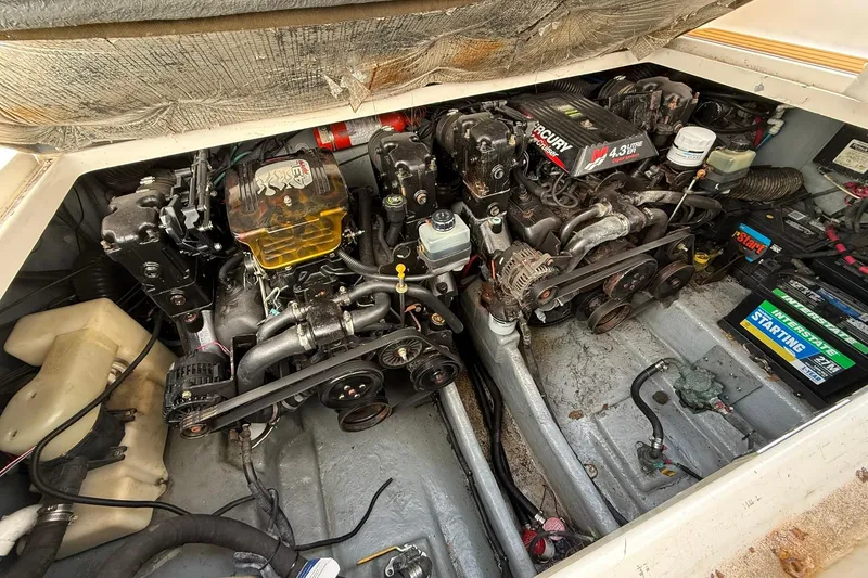 Slide: The Image of Engine compartment of a 2001 Sea Ray 280 Sundancer with dual MerCruiser engines. - 19