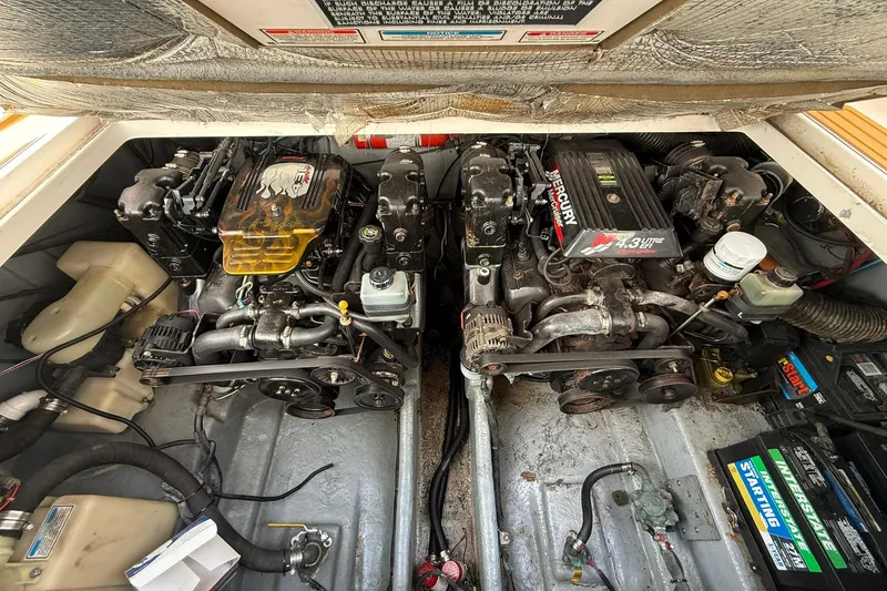 Slide: The Image of Engine compartment of a 2001 Sea Ray 280 Sundancer with dual Mercury engines. - 20