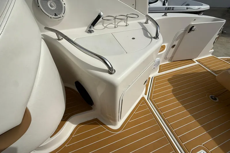 Slide: The Image of 2001 Sea Ray 280 Sundancer boat interior with speaker and cup holders. - 7