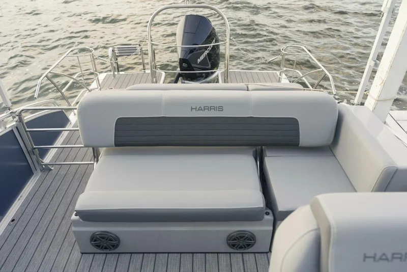 Slide: The Image of 2023 Harris Solstice 250 boat interior with gray seating and water view. - 7