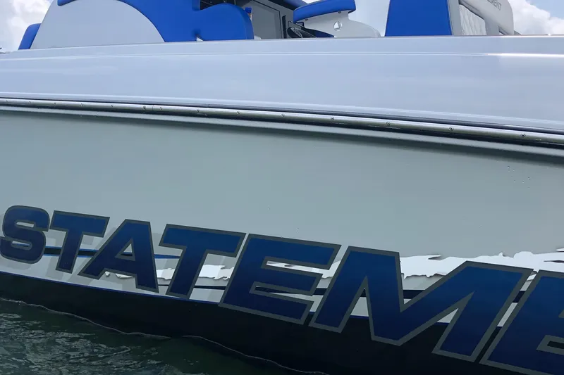Slide: The Image of 2019 Statement Center Console boat with blue lettering. - 10