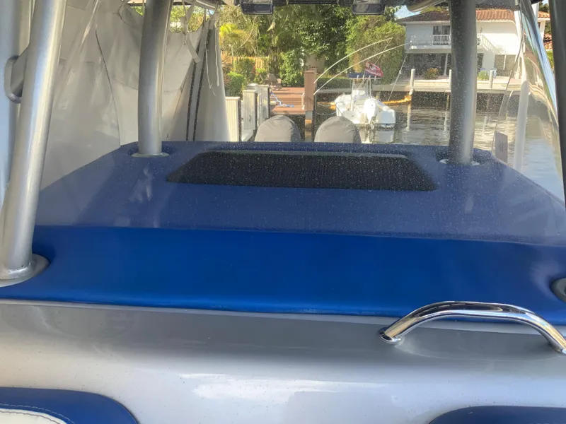 Slide: The Image of 2019 Statement Center Console boat with blue upholstery. - 11
