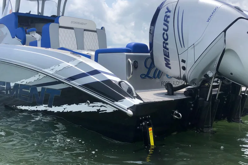 Slide: The Image of 2019 Statement Center Console boat with Mercury outboard motor. - 12