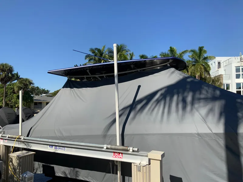 Slide: The Image of Covered 2019 Statement Center Console boat outdoors. - 13