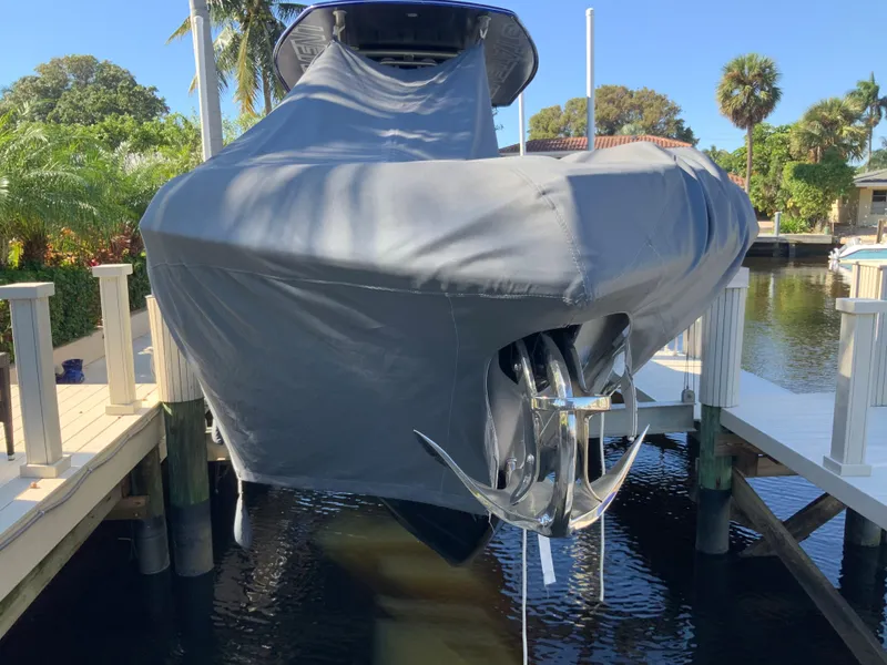 Slide: The Image of Covered 2019 Statement Center Console boat at dock. - 18
