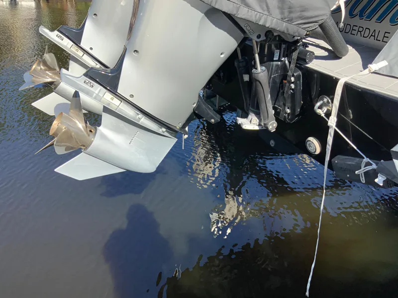 Slide: The Image of 2019 Statement Center Console boat engines in water. - 23