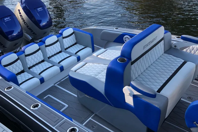 Slide: The Image of Luxurious 2019 Statement Center Console boat with blue and white seating. - 4