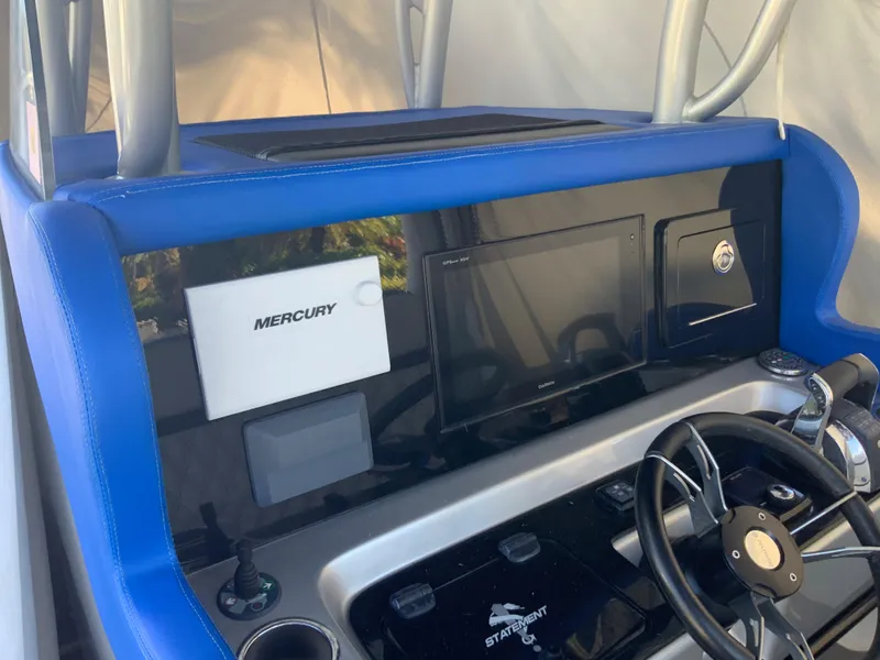Slide: The Image of 2019 Statement Center Console boat dashboard with Mercury system. - 5