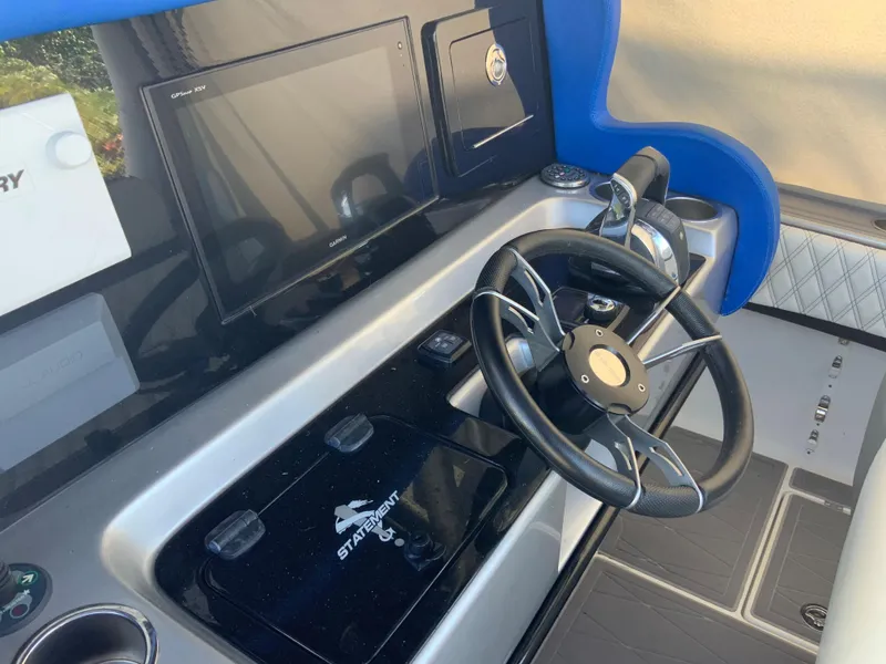 Slide: The Image of 2019 Statement Center Console helm with steering wheel and instruments. - 7