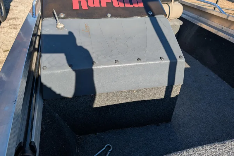 Slide: The Image of 1988 Bass Tracker Pro 17 boat interior with Rapala branding and shadow. - 15
