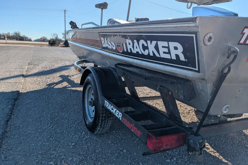 Slide: The Image of 1988 Bass Tracker Pro 17 boat on trailer, parked on gravel road. - 3