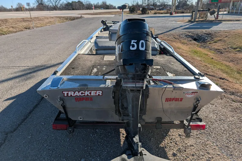 Slide: The Image of 1988 Bass Tracker Pro 17 boat with 50 HP motor, parked on roadside. - 5