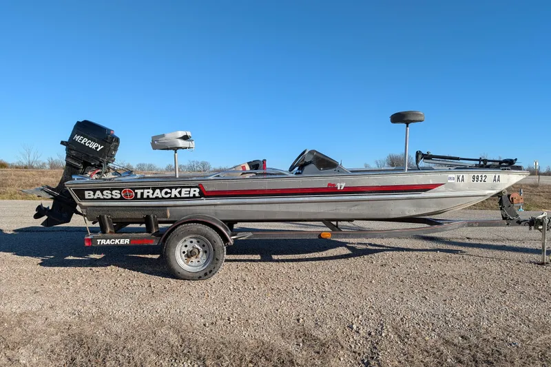 Slide: The Image of 1988 Bass Tracker Pro 17 boat with Mercury engine on trailer, parked outdoors. - 8