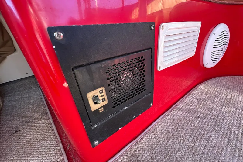 Slide: The Image of Red interior of 2006 Duffy Cat 16 boat with control panel and speaker. - 12