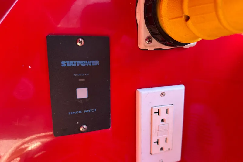 Slide: The Image of Control panel and outlet on a 2006 Duffy Cat 16 boat, featuring Statpower remote switch. - 7