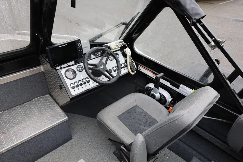 Slide: The Image of 2022 Thunder Jet 185 Luxor boat interior with storage compartments and fishing rod holders. - 14