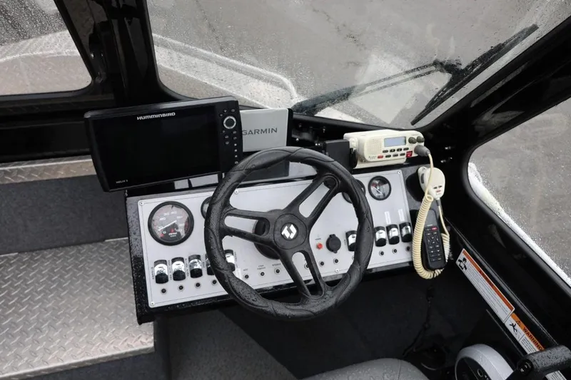 Slide: The Image of 2022 Thunder Jet 185 Luxor boat interior with seating, steering wheel, and control panel. - 15