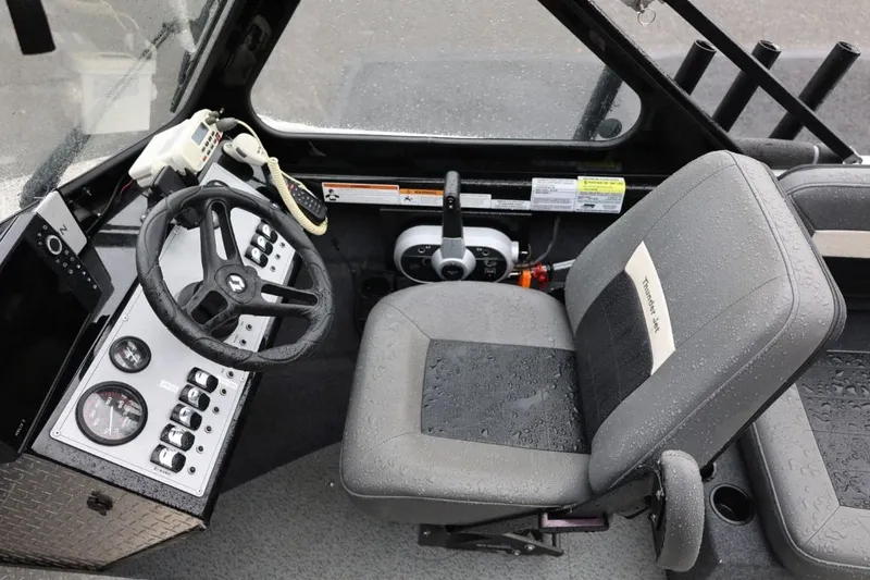 Slide: The Image of Interior of 2022 Thunder Jet 185 Luxor boat with steering wheel and control panel. - 16