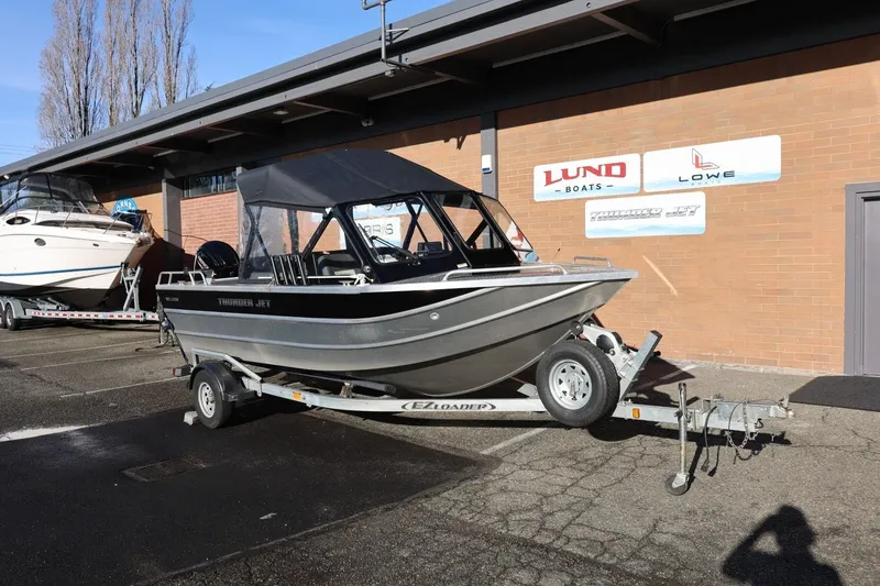 Slide: The Image of 2022 Thunder Jet 185 Luxor boat on trailer, parked outside dealership. - 22