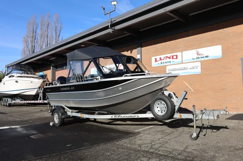 Slide: The Image of 2022 Thunder Jet 185 Luxor boat on trailer outside dealership. - 23