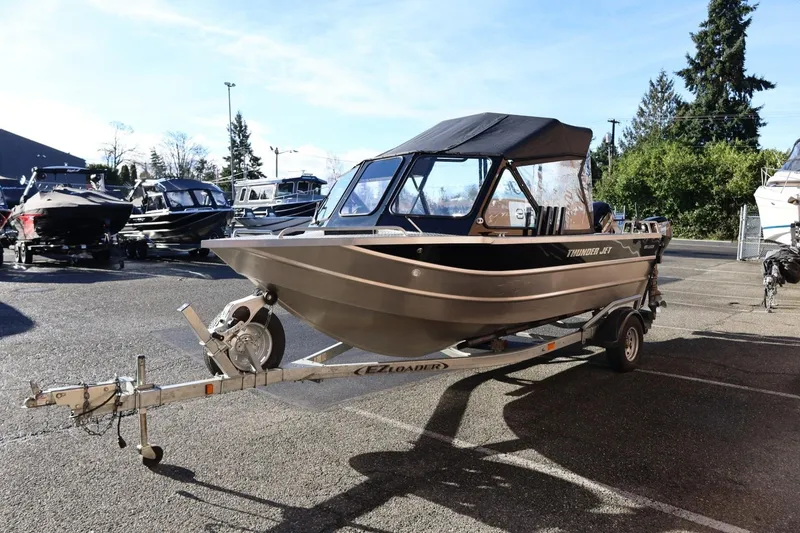 Slide: The Image of 2022 Thunder Jet 185 Luxor boat on trailer in parking lot, sunny day. - 26