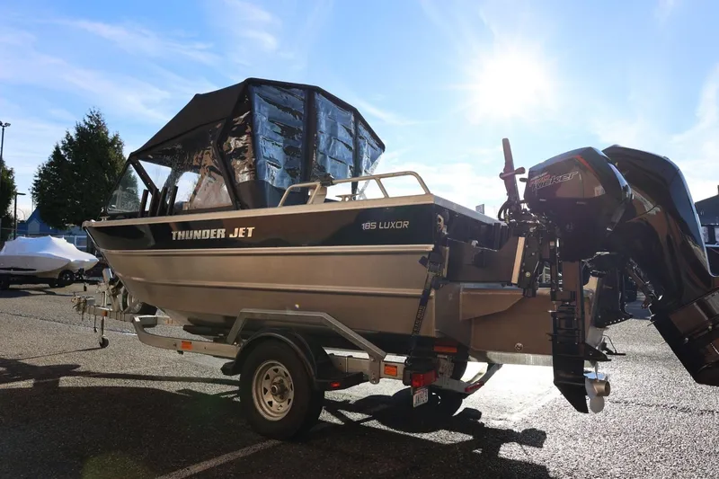 Slide: The Image of 2022 Thunder Jet 185 Luxor boat on trailer under bright sunlight. - 28