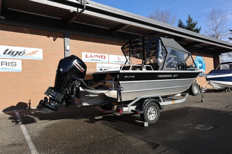Slide: The Image of 2022 Thunder Jet 185 Luxor boat on trailer, parked outside dealership. - 32