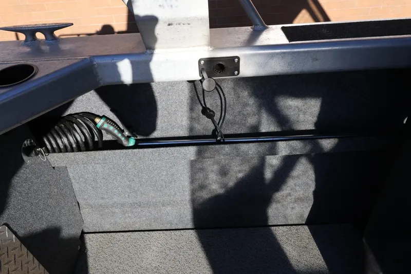 Slide: The Image of Interior view of 2022 Thunder Jet 185 Luxor boat, featuring hose and storage area. - 34