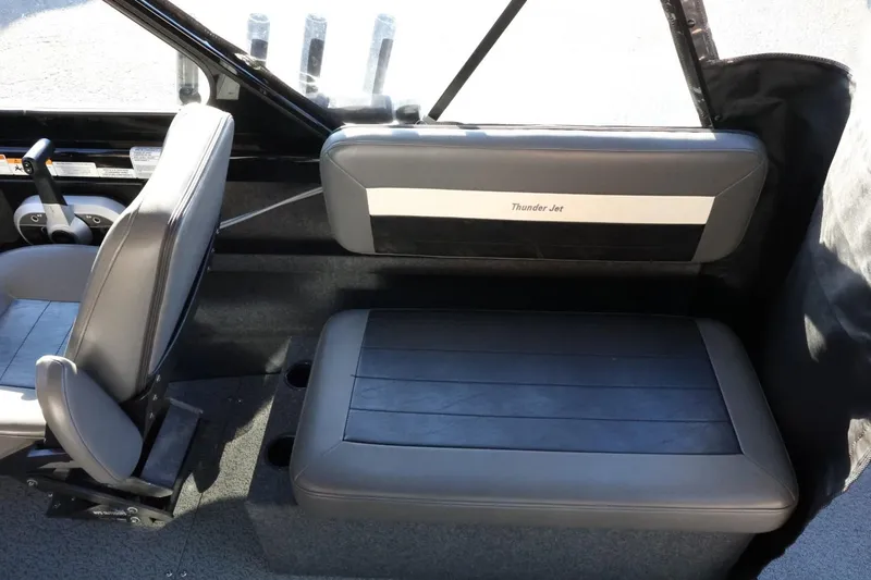 Slide: The Image of 2022 Thunder Jet 185 Luxor interior seating with gray upholstery and cup holders. - 41