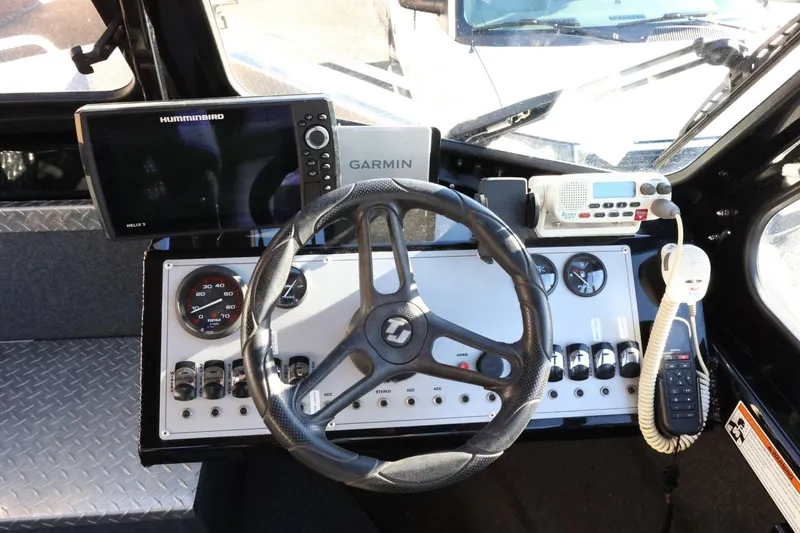 Slide: The Image of Control panel of 2022 Thunder Jet 185 Luxor boat with steering wheel and navigation equipment. - 43