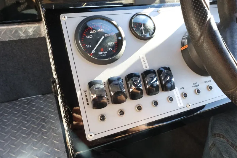 Slide: The Image of Dashboard of 2022 Thunder Jet 185 Luxor boat with RPM gauge and control switches. - 44