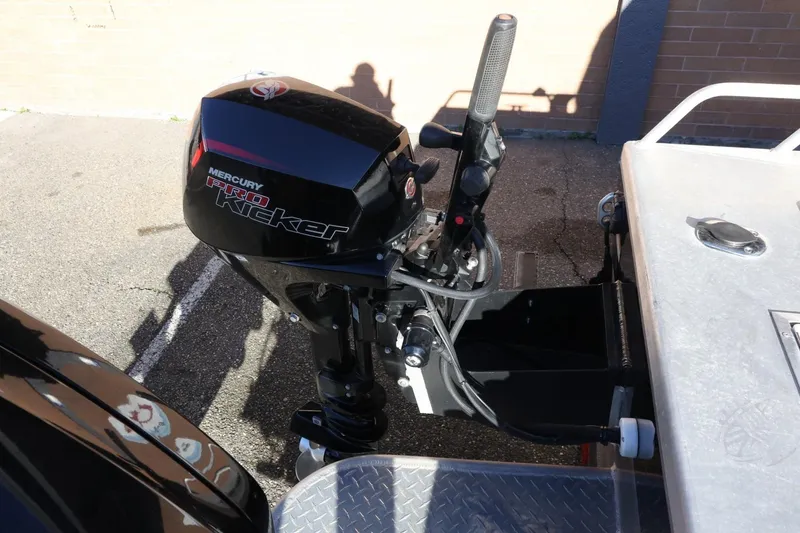 Slide: The Image of Mercury Pro Kicker motor on 2022 Thunder Jet 185 Luxor boat, parked on pavement. - 50