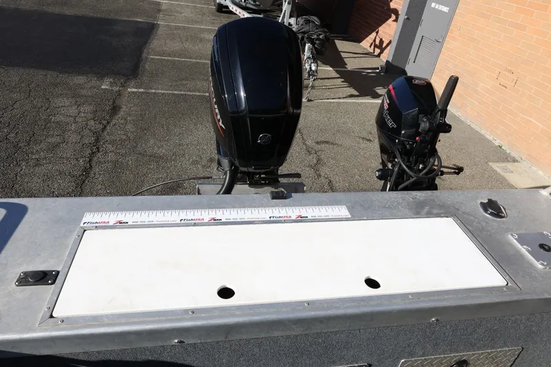 Slide: The Image of 2022 Thunder Jet 185 Luxor boat with dual outboard motors and measuring ruler. - 52