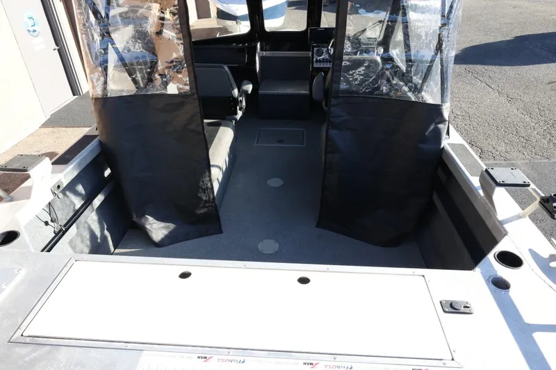 Slide: The Image of 2022 Thunder Jet 185 Luxor boat interior with seating and protective covers. - 57