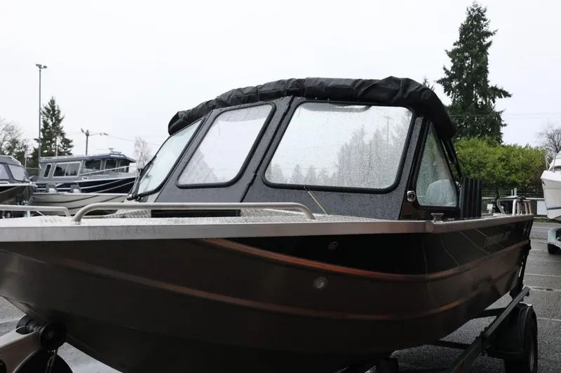 Slide: The Image of 2022 Thunder Jet 185 Luxor boat on trailer, parked outside dealership. - 9