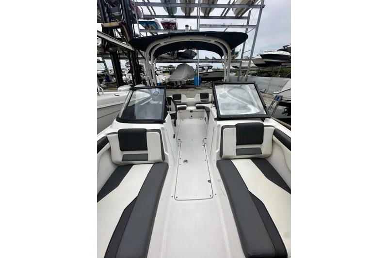 Slide: The Image of 2021 Yamaha Boats AR210 interior with sleek seating and modern design. - 5