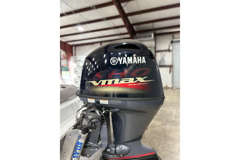 Slide: The Image of Yamaha VMAX outboard motor on 2022 Express H20 Bay boat in a warehouse. - 19