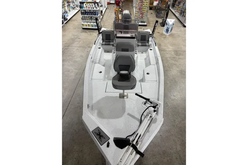 Slide: The Image of 2022 Express H20 Bay boat in showroom, featuring sleek design and modern seating. - 6