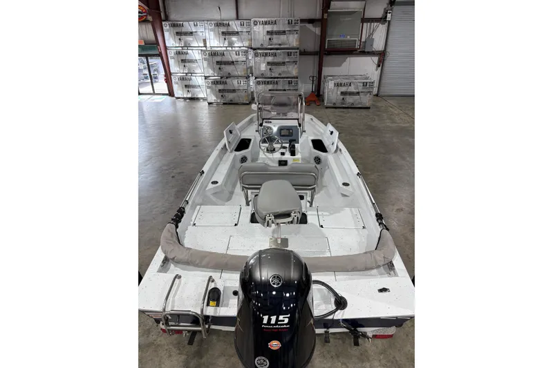 Slide: The Image of 2022 Express H20 Bay boat with Yamaha engine in warehouse setting. - 8