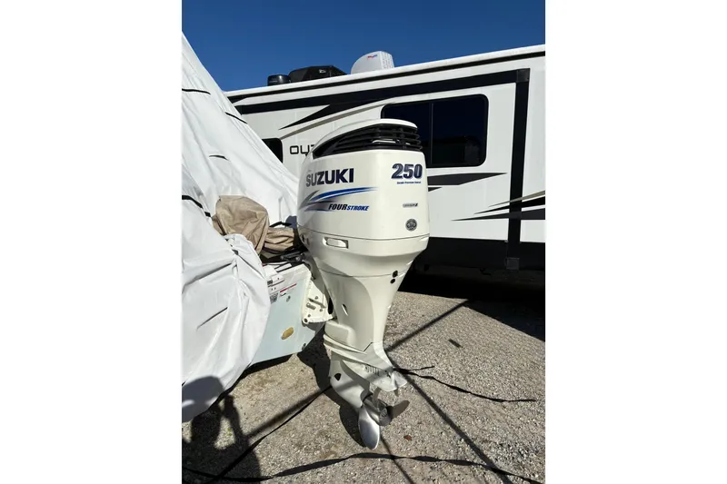 Slide: The Image of Suzuki 250 outboard motor on 2016 Sea Fox 249 Avenger, parked near RV. - 10