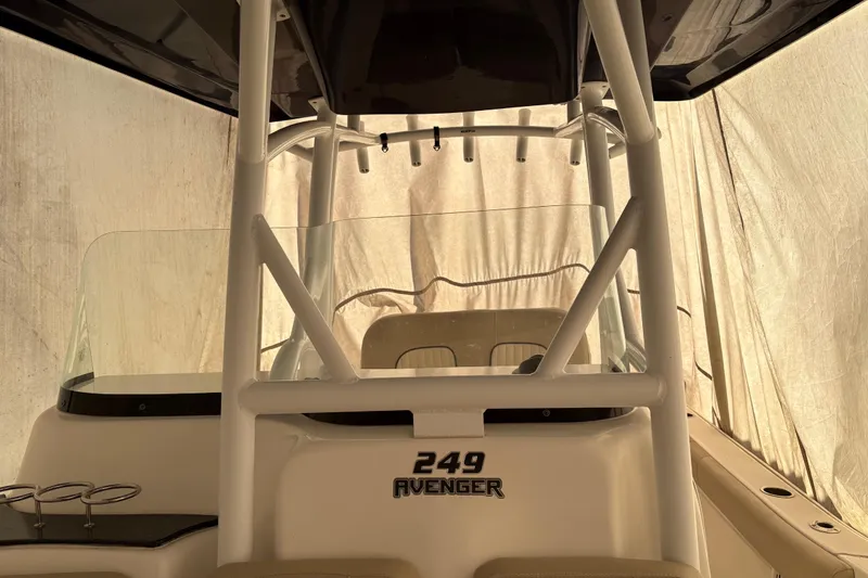 Slide: The Image of 2016 Sea Fox 249 Avenger boat interior with T-top and windshield. - 19