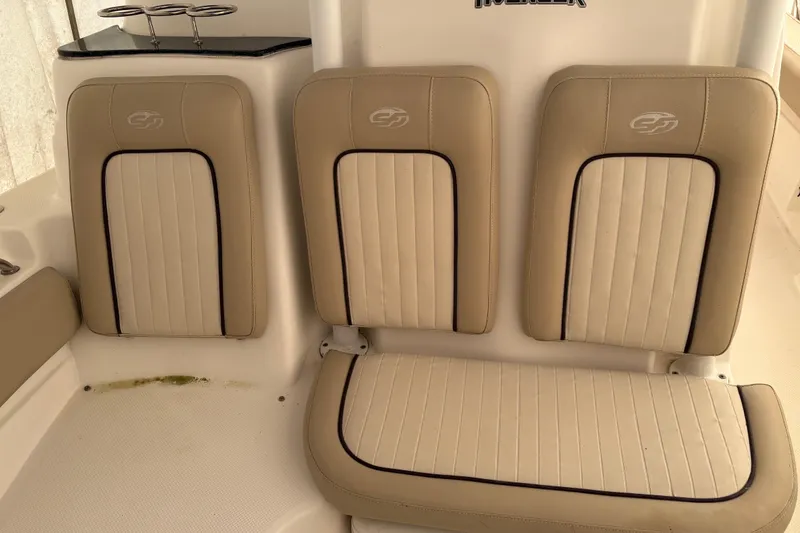 Slide: The Image of 2016 Sea Fox 249 Avenger boat seats with beige upholstery and cup holders. - 21