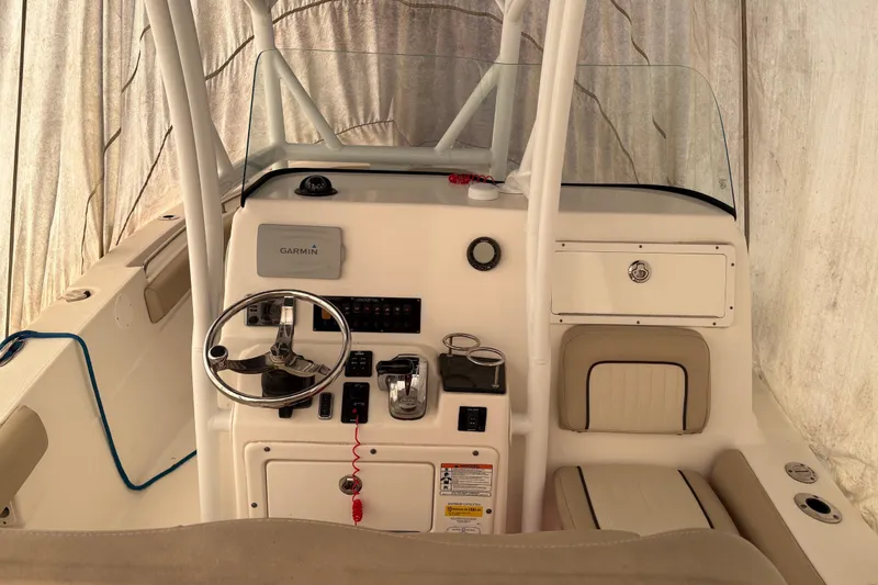 Slide: The Image of 2016 Sea Fox 249 Avenger boat console with Garmin navigation system and steering wheel. - 22