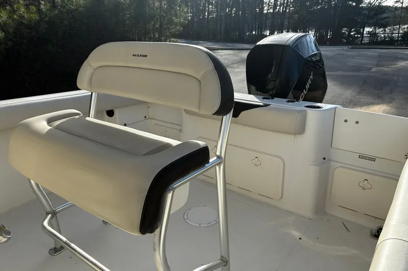 Slide: The Image of 2022 Sailfish 242 CC boat seat with beige upholstery and sturdy metal frame. - 11