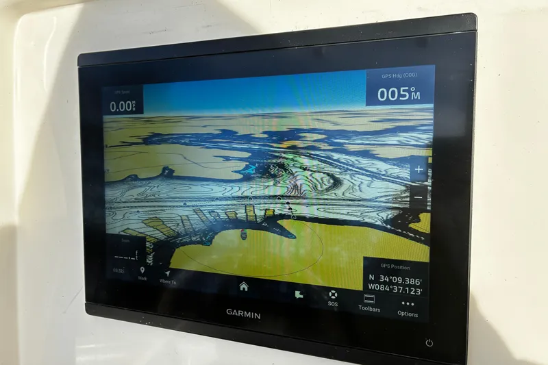 Slide: The Image of Bennett trim tab control panel on 2022 Sailfish 242 CC boat. - 16