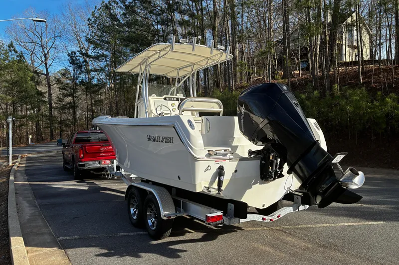 Slide: The Image of 2022 Sailfish 242 CC boat on trailer with powerful outboard motor. - 5