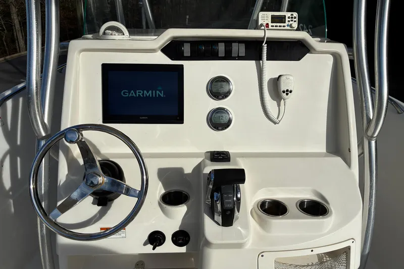 Slide: The Image of 2022 Sailfish 242 CC boat interior with spacious seating and modern design. - 9