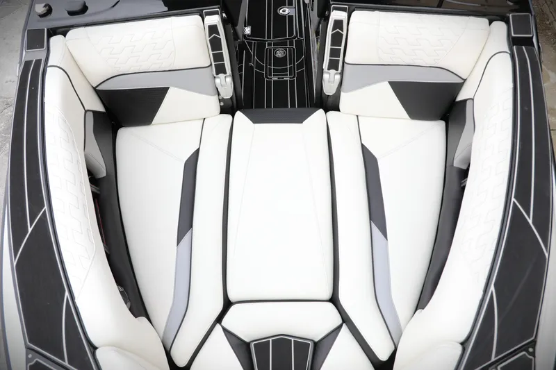 Slide: The Image of Luxurious interior of 2026 Centurion Ri245 boat with sleek white and black seating. - 11