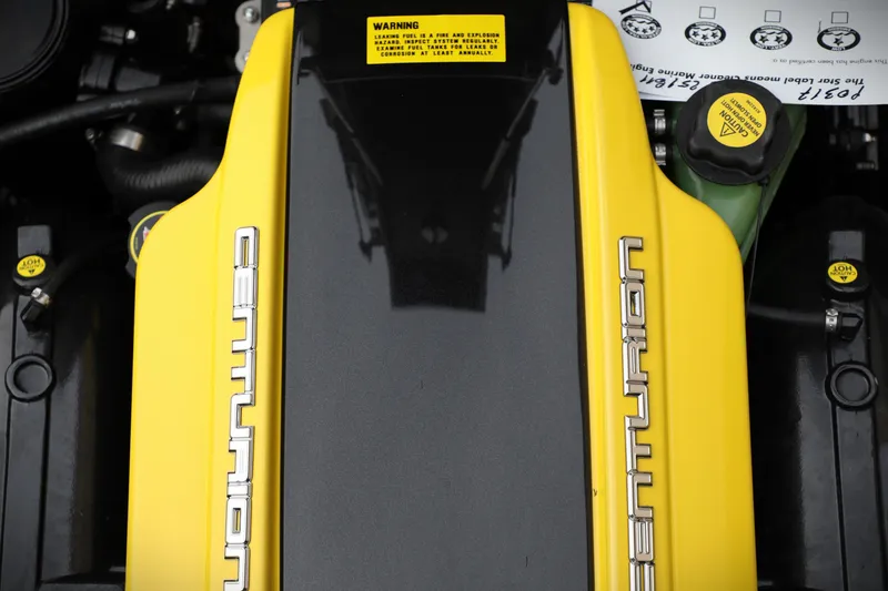 Slide: The Image of 2026 Centurion Ri245 engine cover with yellow accents and branding. - 24